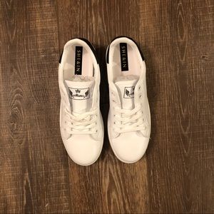 White sneakers with black details